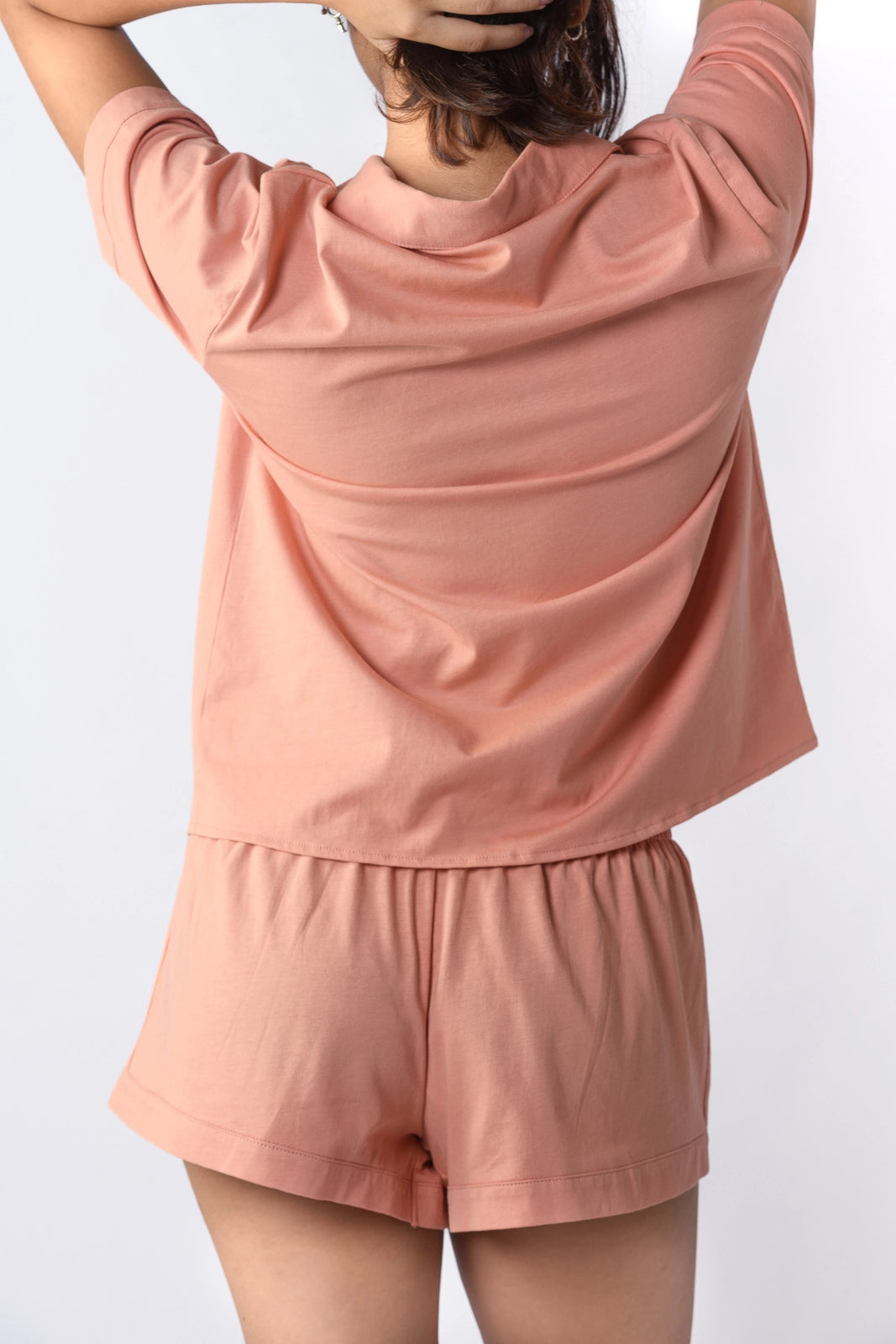 Stylish soft coral pink sleepwear set with a relaxed fit—perfect for effortless lounging. Elevate your comfort in style. Shop now!